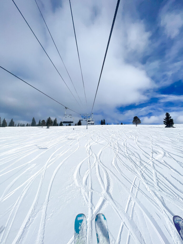 chairlift overlooking fresh powder on a ski mountain in Vail, Colorado