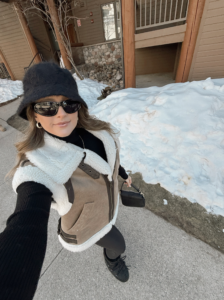 woman in an après ski outfit 