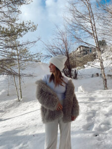 winter whites après ski outfit with fur coat