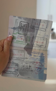 passport open with many different stamps from different countries. relevant because the blog post is talking about how to prevent jet lag on long haul flights
