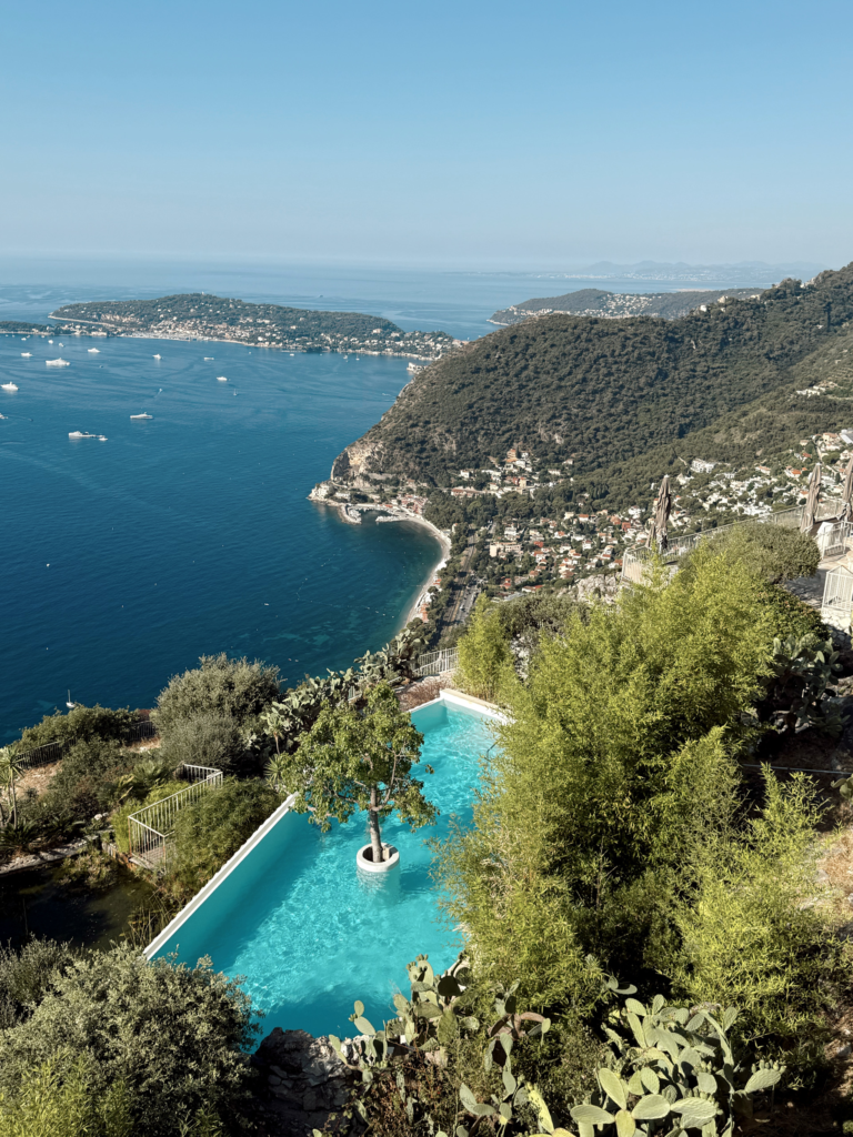 pool with a tree in the middle overlooking the Mediterranean in the South of France. Used to emphasize luxury travel for the luxury travel hacks provided