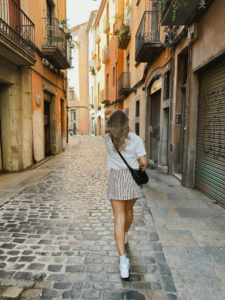 woman walking through the streets of Barcelona during euro summer