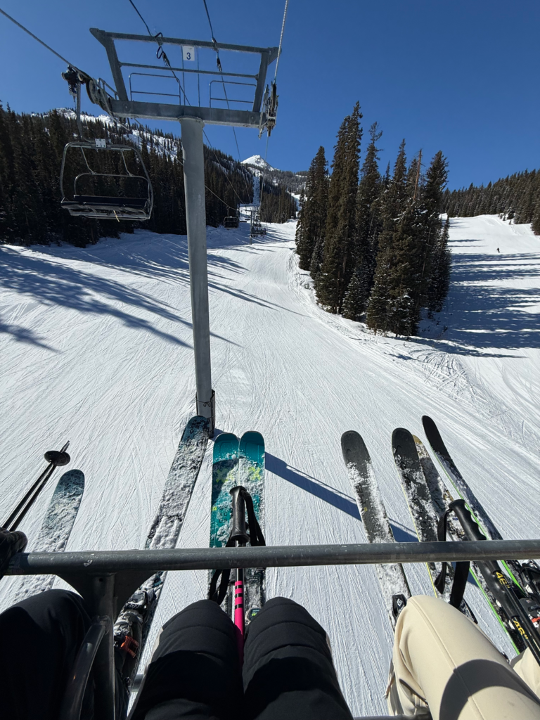Skis on a chairlift at Crested Butte Mountain Resort, Colorado.